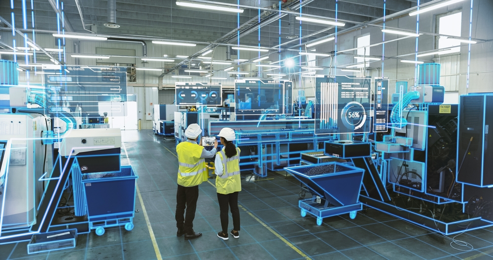 Two workers in a smart factory working