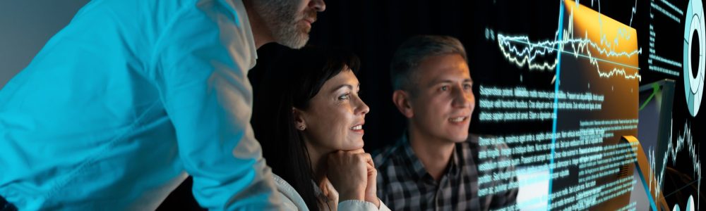 Team,Of,Professionals,Analyzing,Digital,Data,On,Futuristic,Screen,,Collaborative